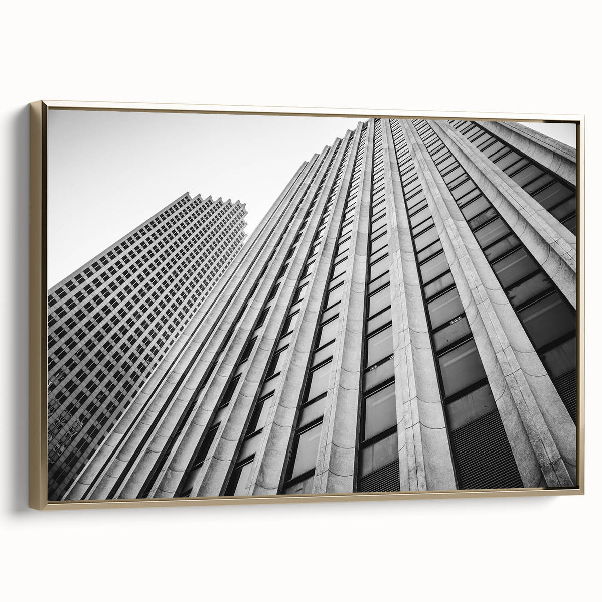 Framed canvas featuring a vintage-style landscape painting of the Houston skyline in muted gold and black tones.