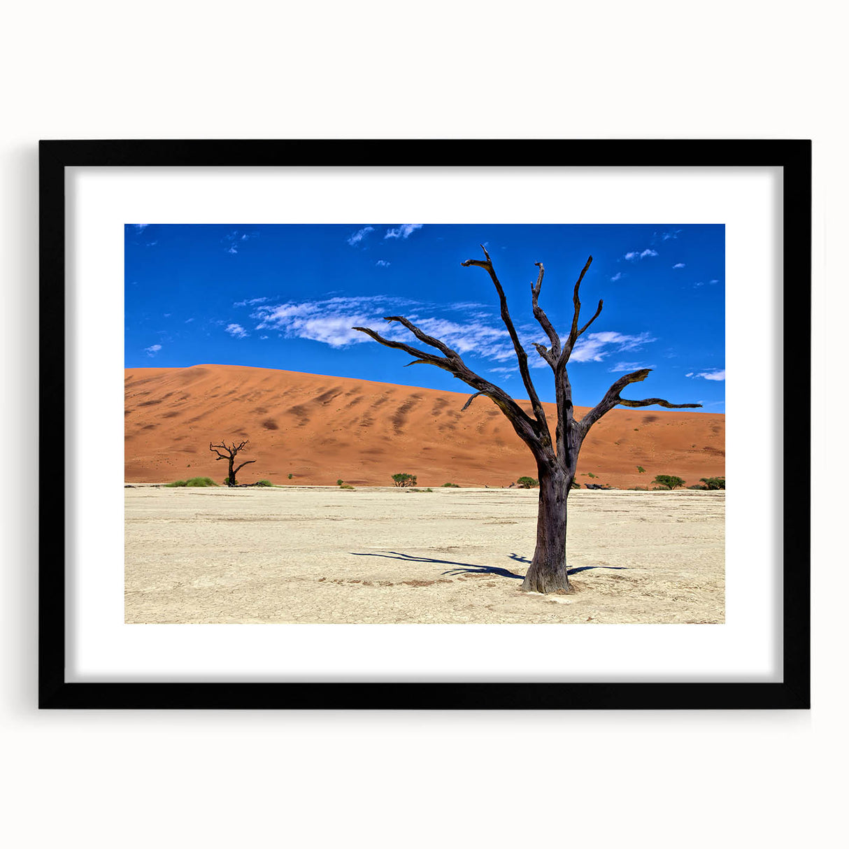 Abstract art print of an African scenery in vibrant colors on a textured, extra large canvas, framed in black.