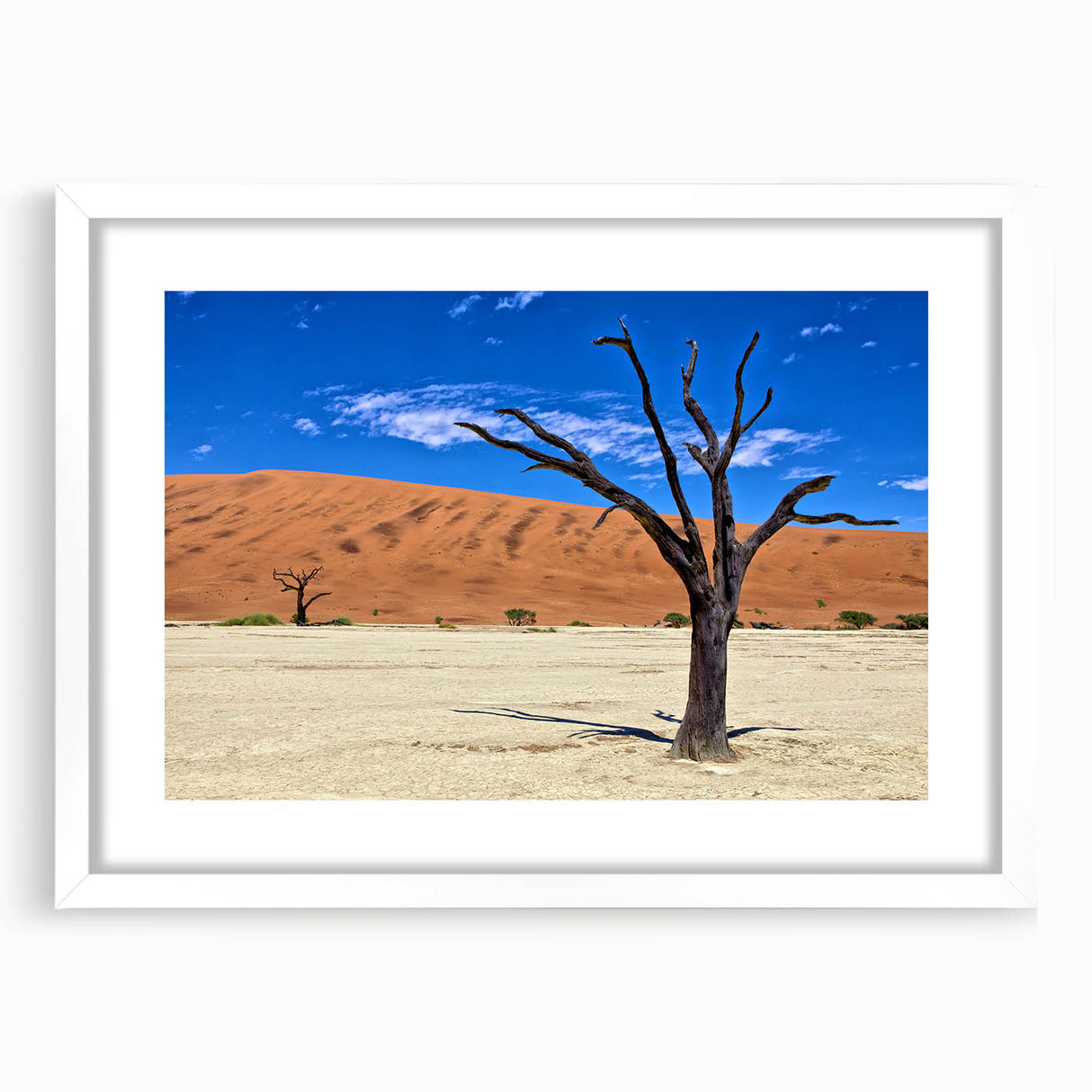 Extra large wall art depicting an abstract African landscape in textured earth tones, framed in white.