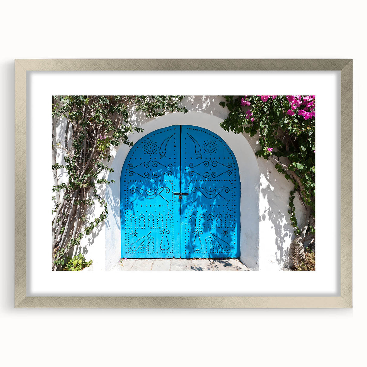 Textured abstract art print depicting a Tunisian landscape in earth tones, framed in silver, suitable for bedroom decor.