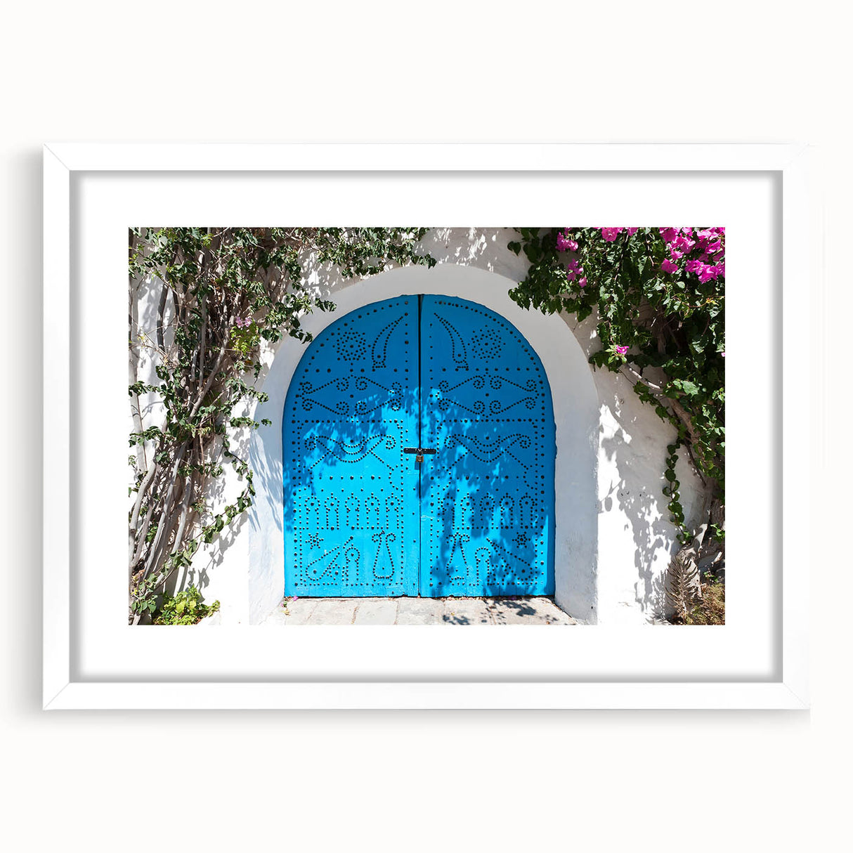 Abstract art print of a Tunisian landscape in muted earth tones on a framed white mat, ideal for dining room decor.