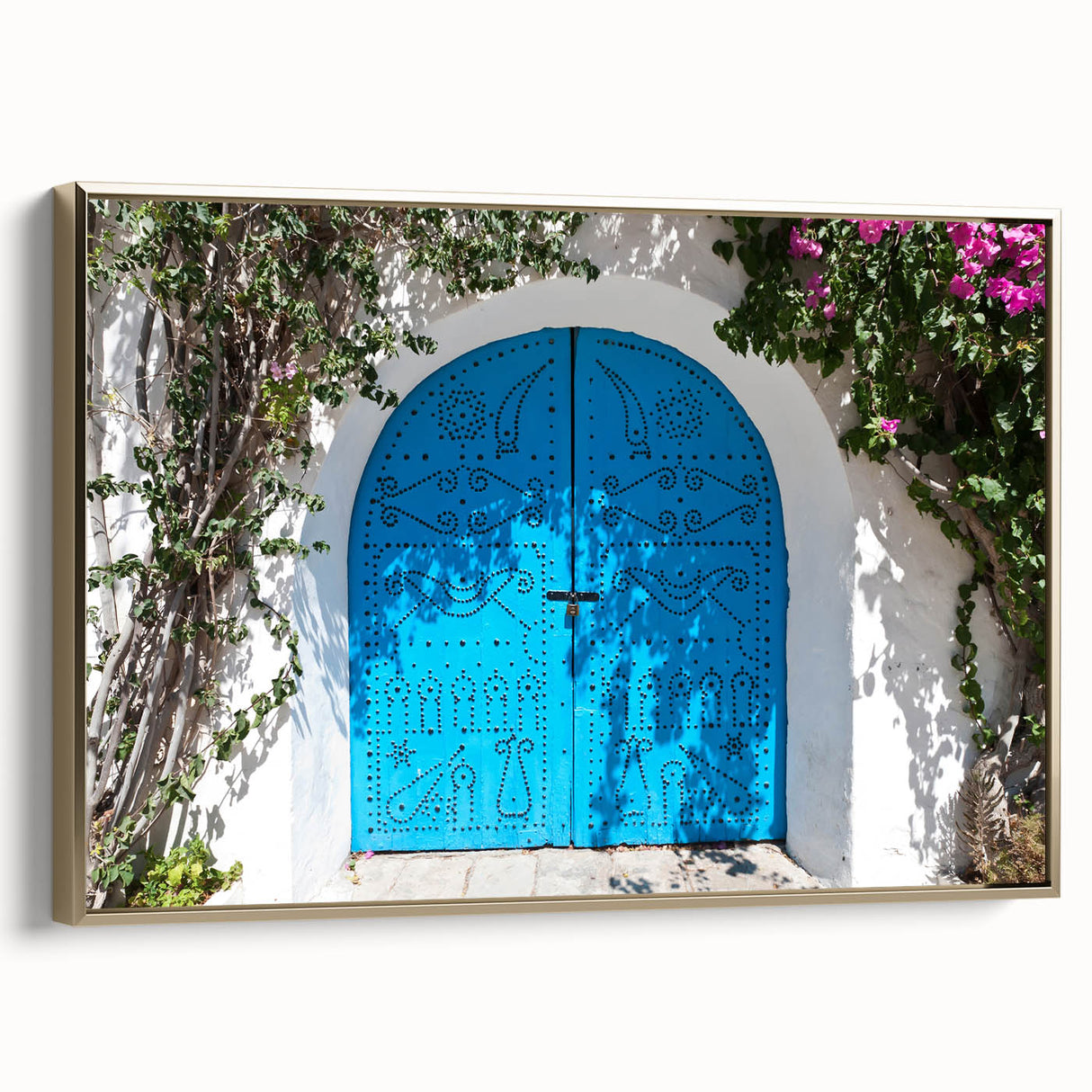 Framed canvas of a Tunisian landscape in muted gold and black tones, ideal for bedroom wall art.