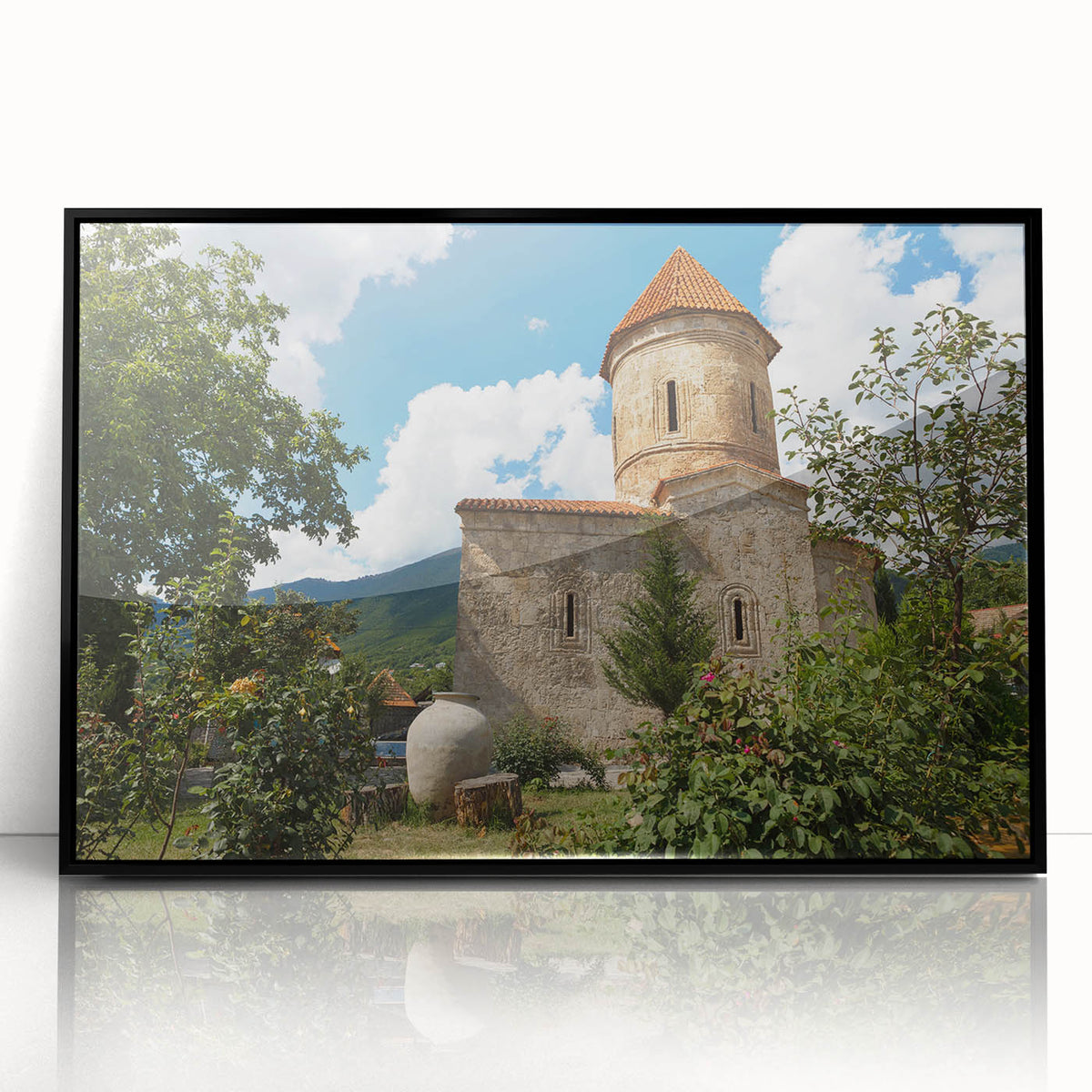 Large abstract wall art depicting an Asian scenery in muted earth tones, framed in black acrylic.
