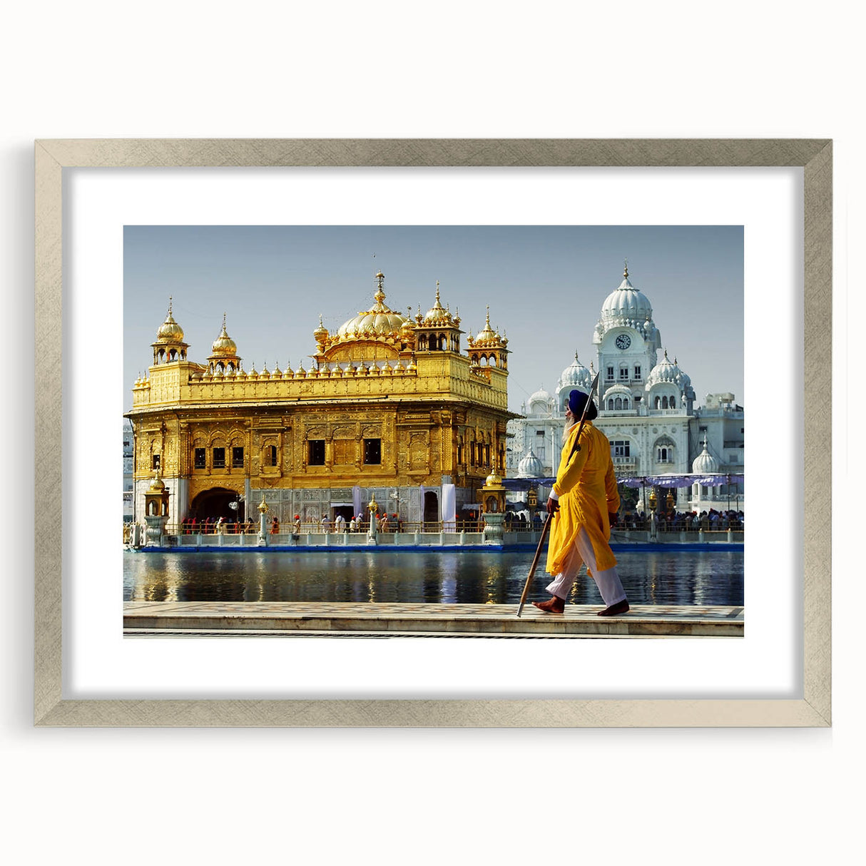 Textured art depicting a serene Asian landscape in muted greens and blues on a framed silver mat, suitable for bedroom decor.