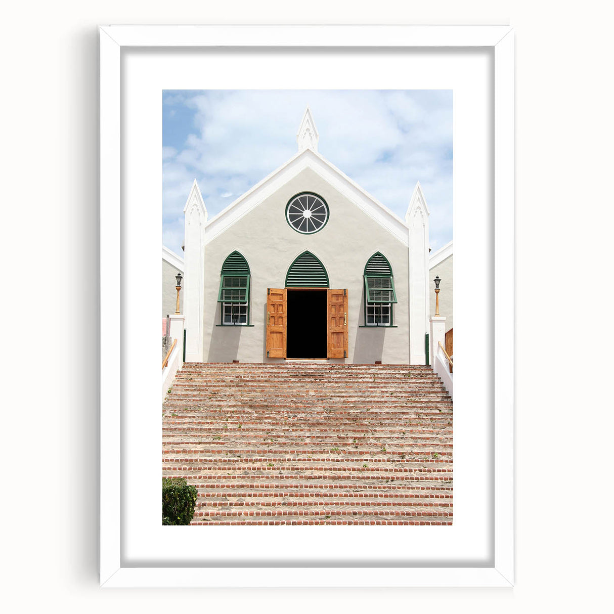 Textured art print of an abstract Caribbean scenery in muted blue and green, framed in white, ideal for bedroom wall decor.