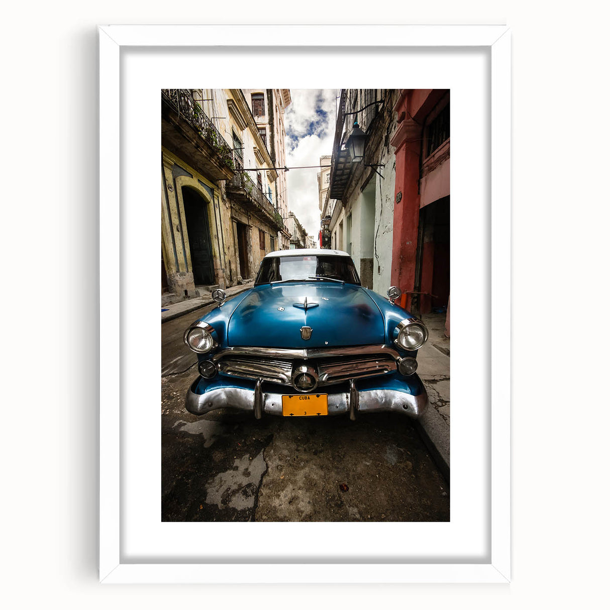 Textured abstract art print depicting Caribbean scenery in vibrant blues and greens, framed with a white mat.