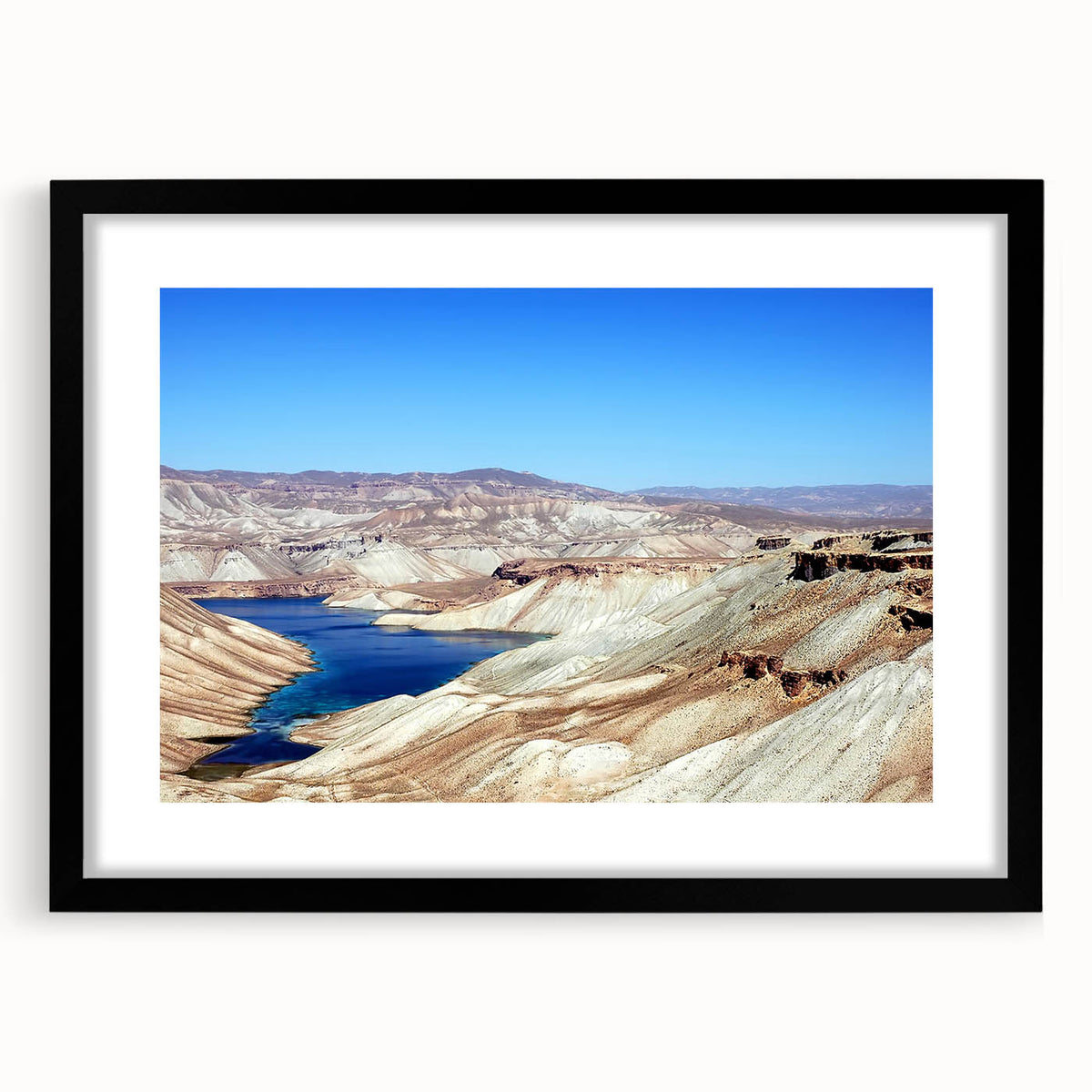 Abstract art print featuring a colorful, textured depiction of a Middle Eastern landscape on a large framed canvas.