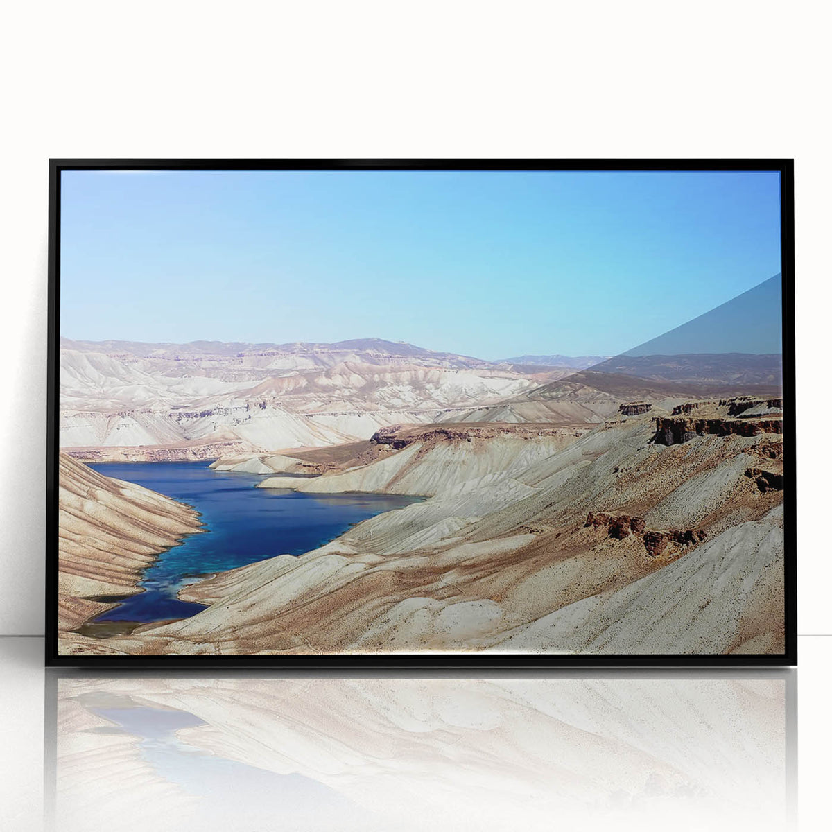 Large abstract wall art depicting a Middle Eastern scenery in muted earth tones on a framed acrylic print.