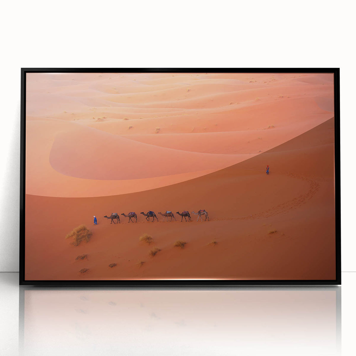 Large abstract wall art featuring a stylized Middle Eastern landscape in muted earth tones, framed in black acrylic.
