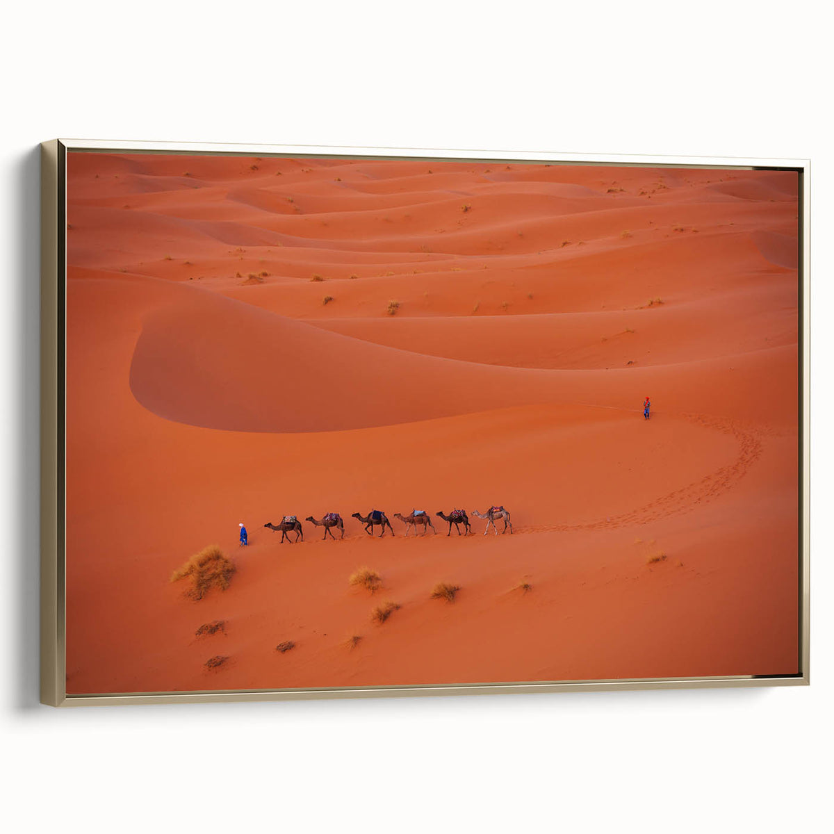 Framed canvas featuring a vintage-style landscape painting of a Middle Eastern scenery in gold and black tones.
