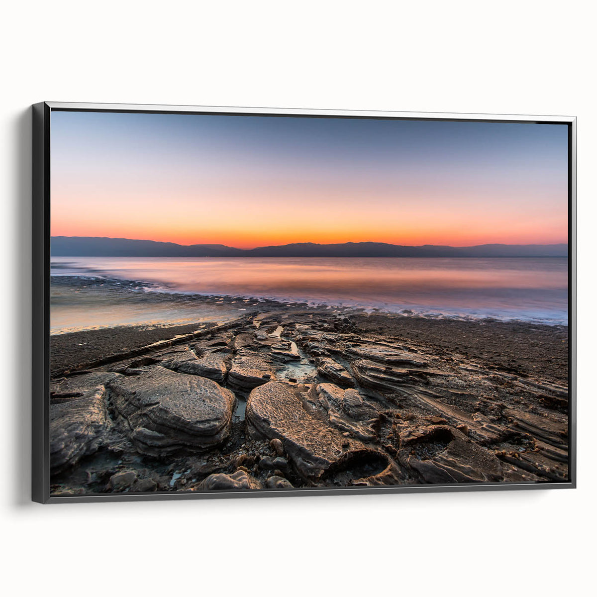 Black and white framed canvas depicting the Dead Sea landscape, ideal for bedroom wall art.