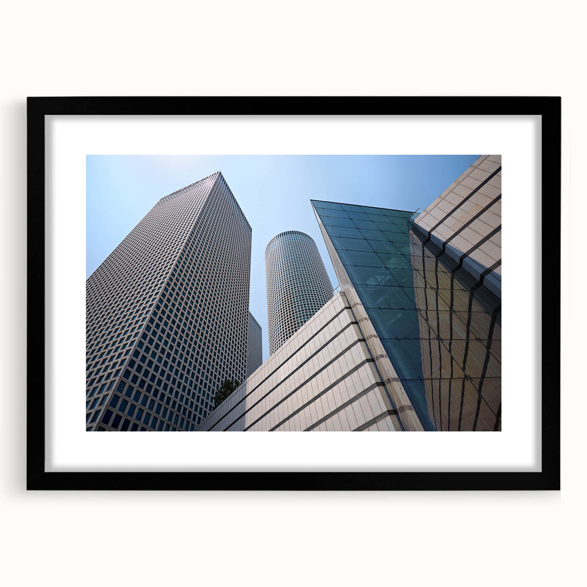 Extra large, colorful abstract art print of Tel Aviv skyline in vibrant hues on textured canvas, framed in black.