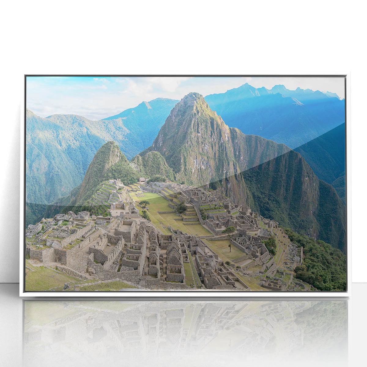 Acrylic print of Machu Picchu in muted earth tones, framed in white, suitable for modern art wall decor.