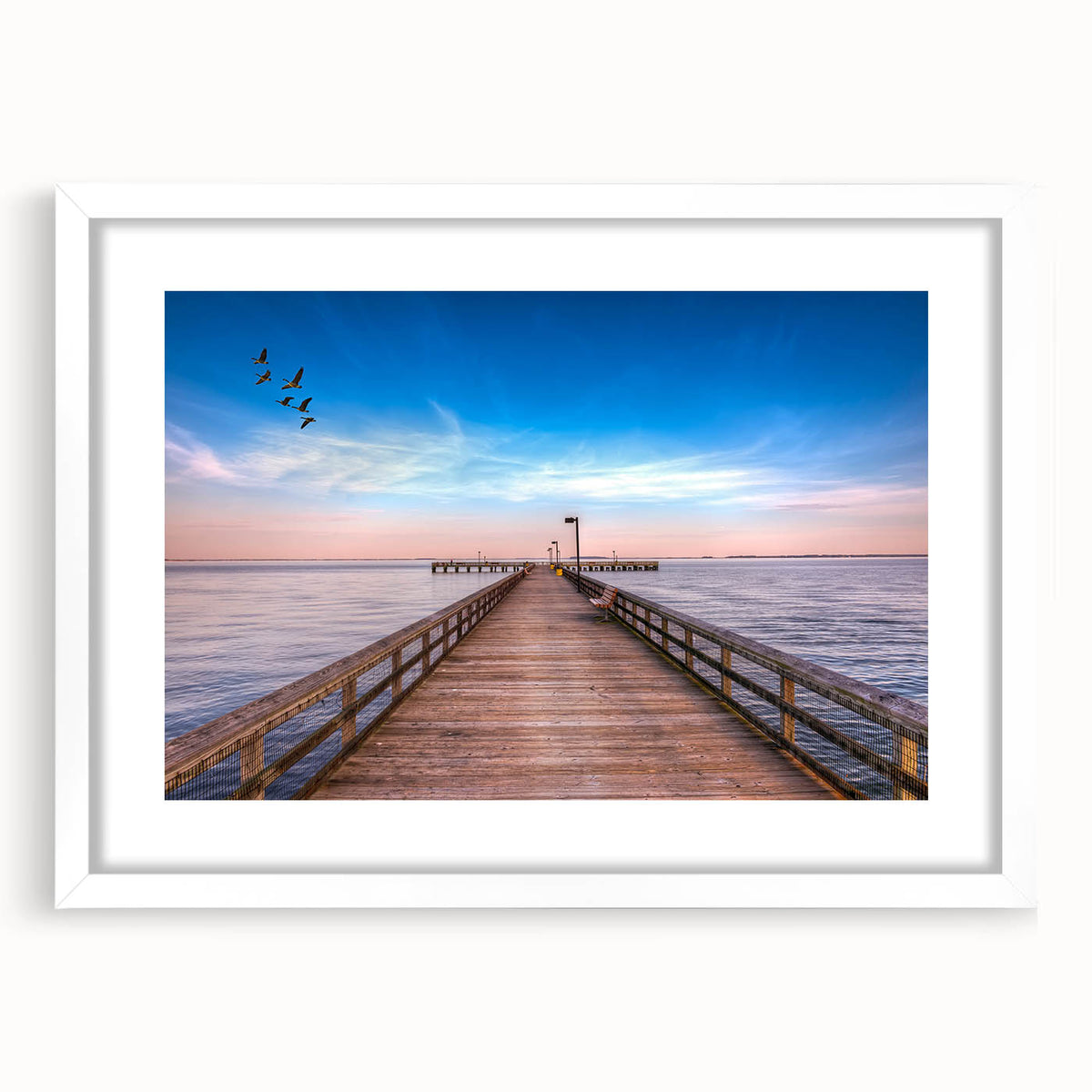 Abstract art print of Chesapeake Bay in muted blue and green tones, framed in white, suitable for dining room decor.