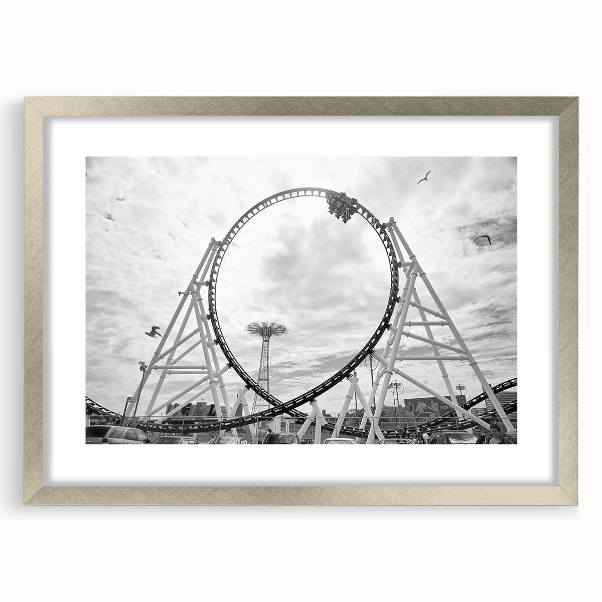 Textured art print depicting an abstract Coney Island scene in muted blue and gray tones on a framed silver mat.