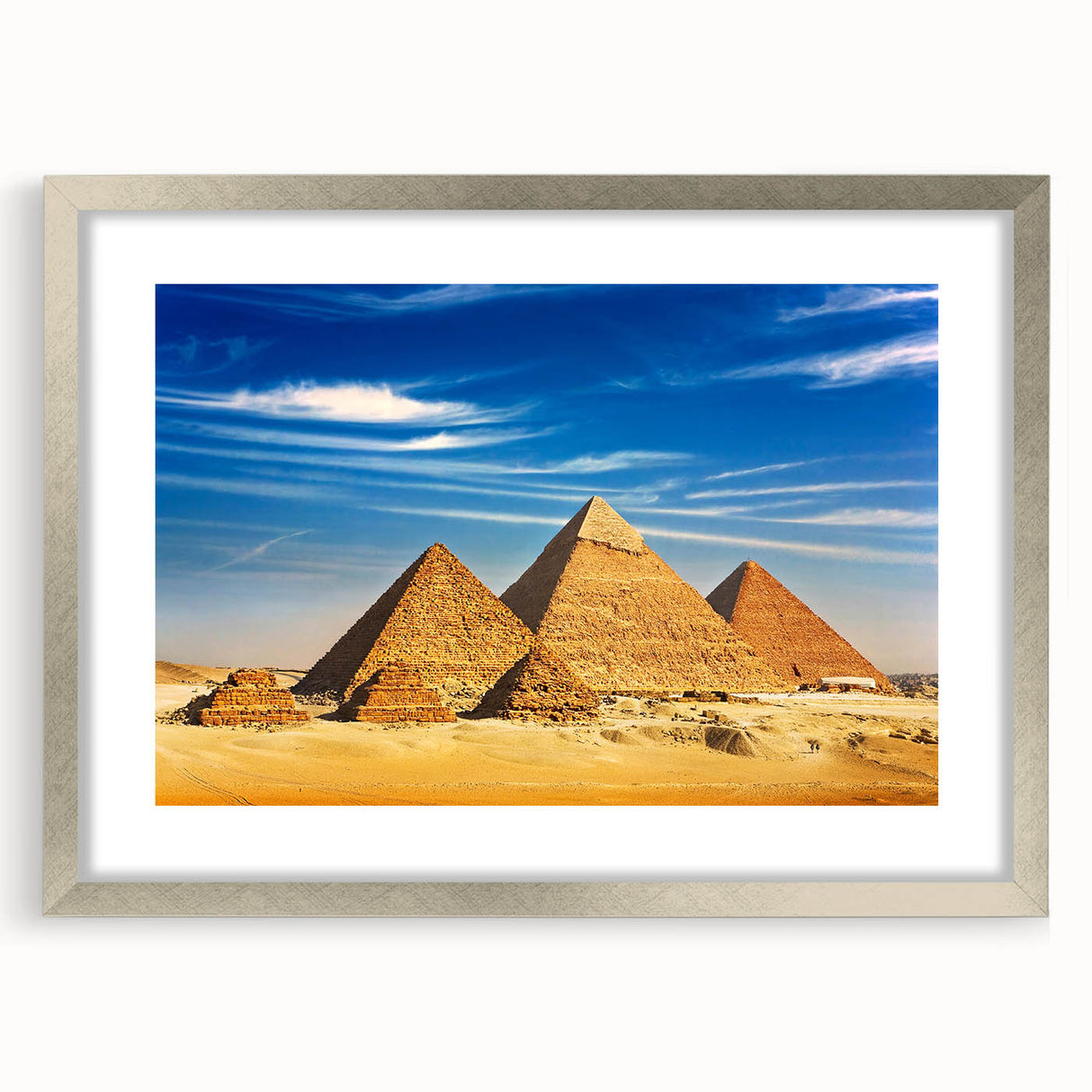 Abstract art print of Egyptian scenery in muted earth tones on a framed silver mat, suitable for dining room decor.