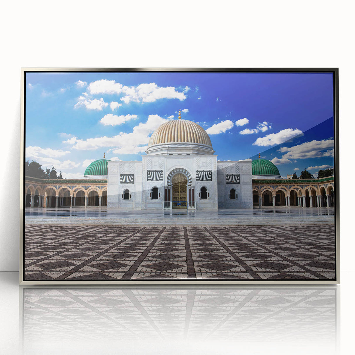 Mid-century modernist art depicting a Tunisian landscape in muted earth tones on a silver-framed acrylic print.