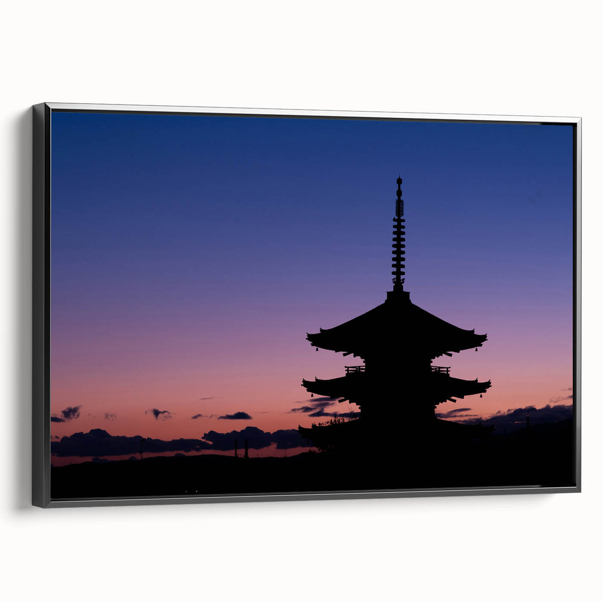 Black and white wall art featuring a vintage poster-style landscape of Kyoto on framed canvas, ideal for bedroom decor.