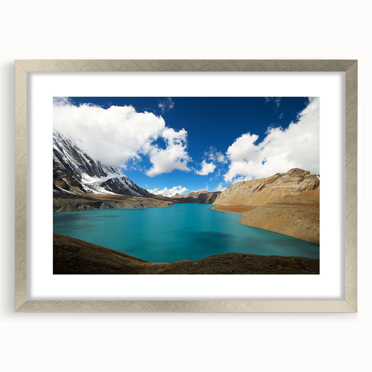 Textured art print of abstract Himalayan landscape in muted earth tones, framed with a silver mat, ideal for bedroom art.