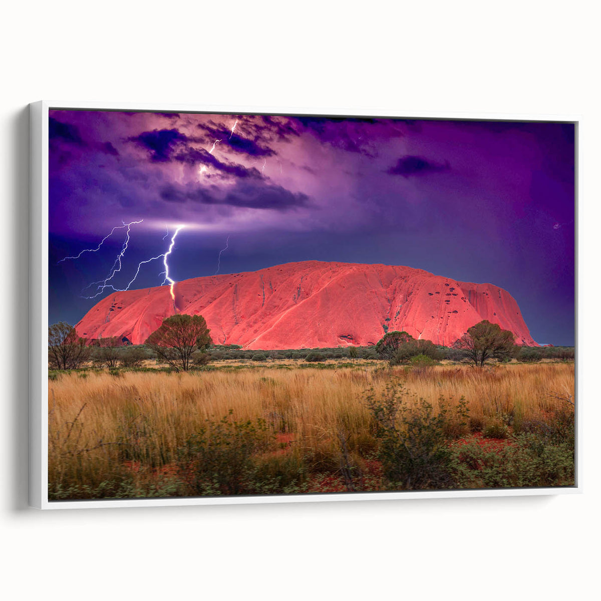 Framed canvas of Ayers Rock landscape in muted earth tones, ideal for bedroom wall art.