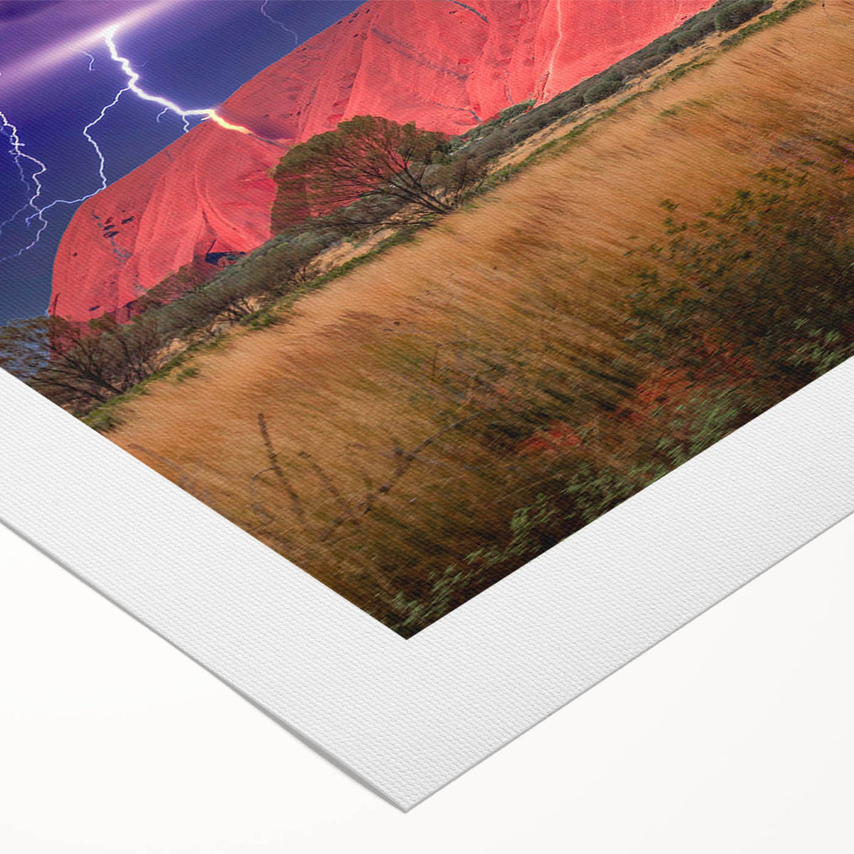 Art deco poster of Ayers Rock in muted orange and brown tones on rolled canvas, suitable for dining room decor.