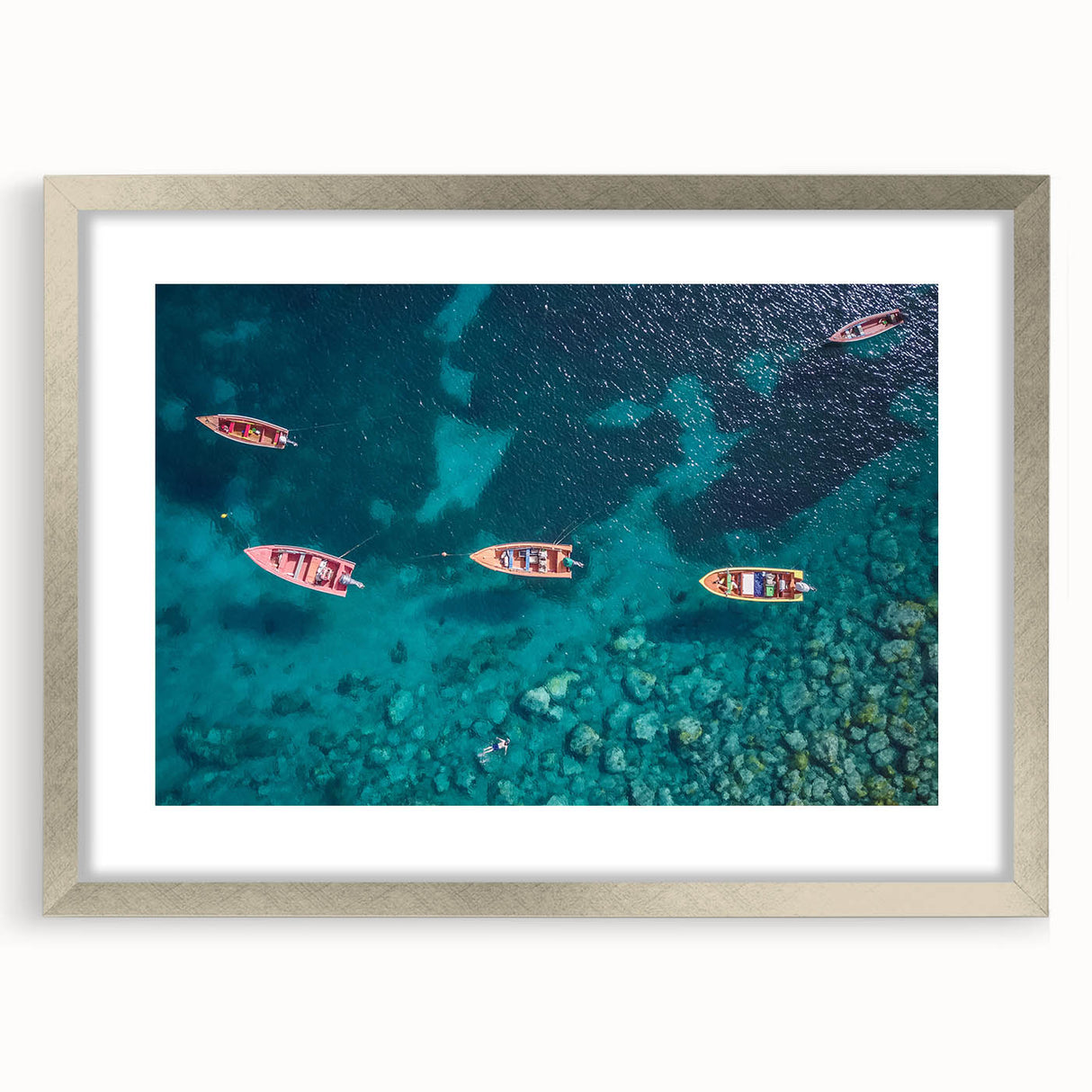 Extra large abstract art print depicting Caribbean scenery in textured shades of blue and green, framed in silver.