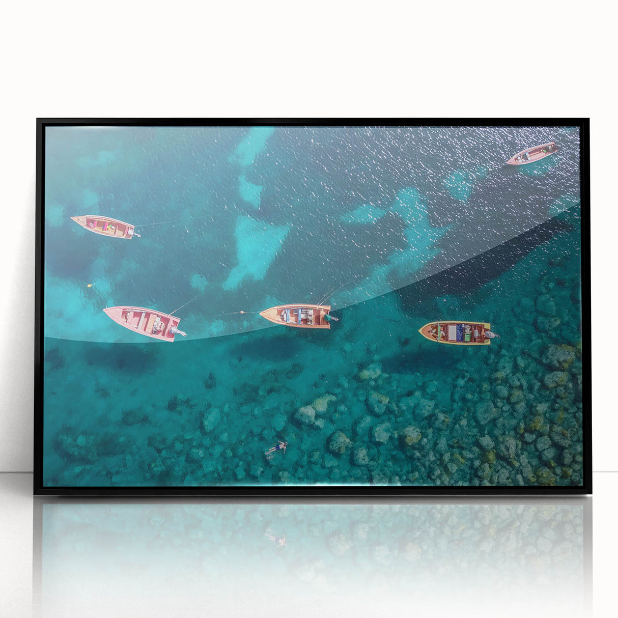 Large abstract wall art depicting a Caribbean scenery in vibrant blue and green tones, framed in black acrylic.