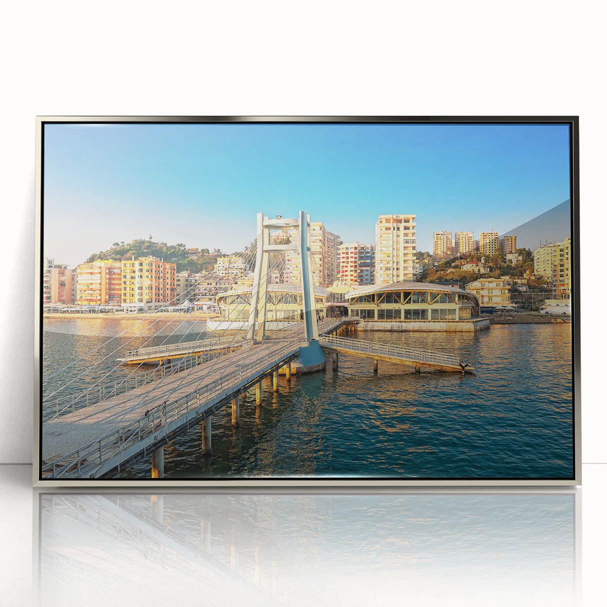 Large art print of a European Albanian landscape in muted greens and blues on a silver-framed acrylic.