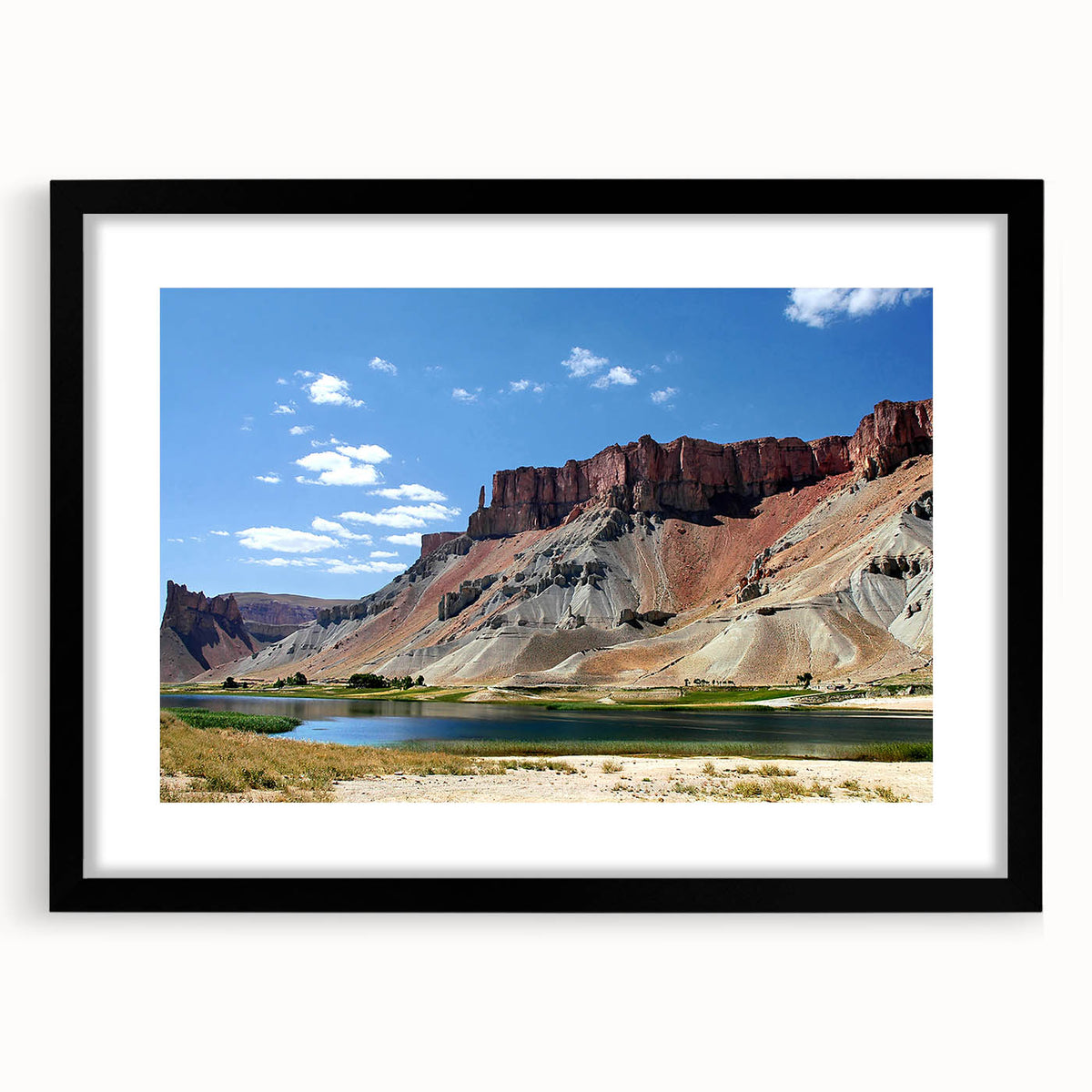 Extra large abstract art print of a colorful, textured Afghan scenery on a black framed canvas, ideal for living room decor.