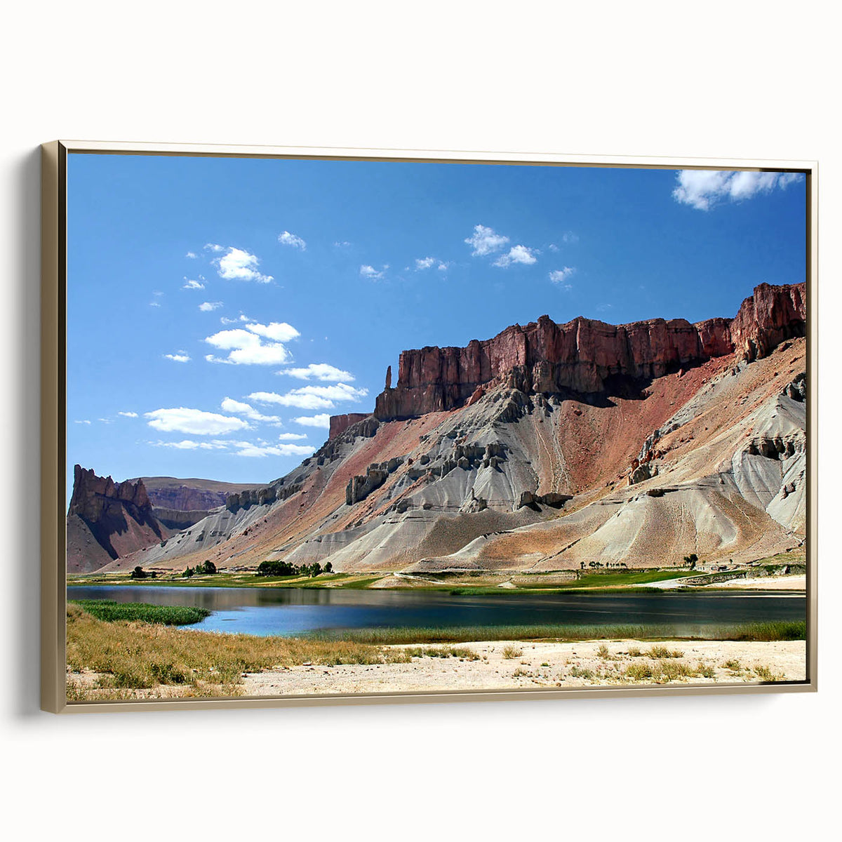 Framed canvas depicting a vintage-style landscape of Middle Eastern scenery, dominated by black and gold tones.