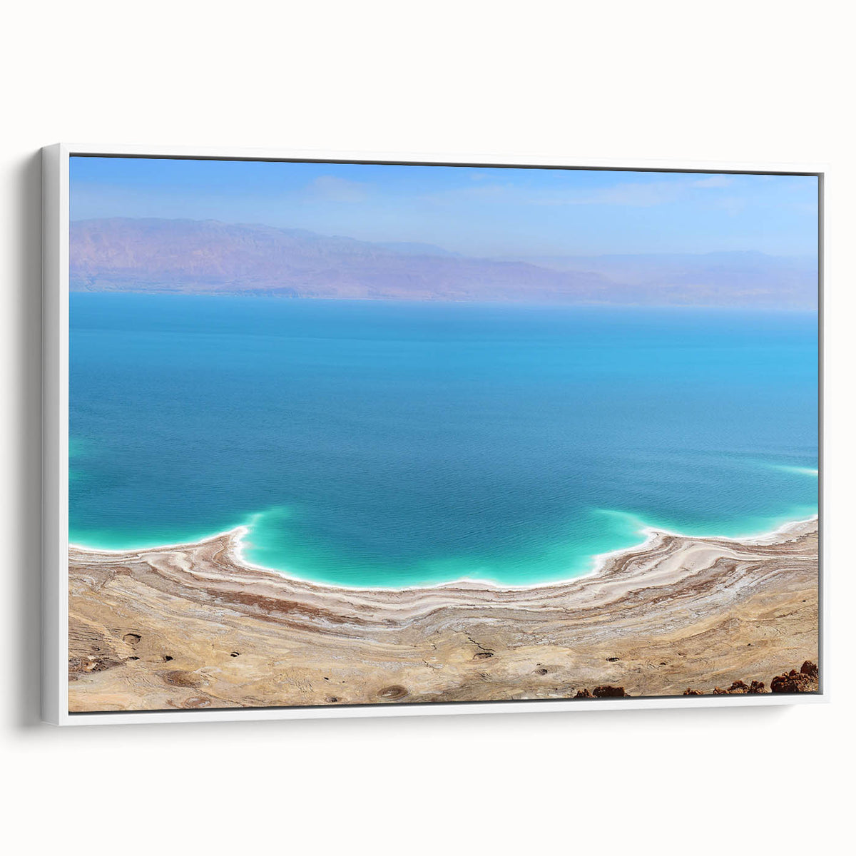 Vintage poster art of the Dead Sea in muted blues and whites on framed canvas, suitable for living room decor.