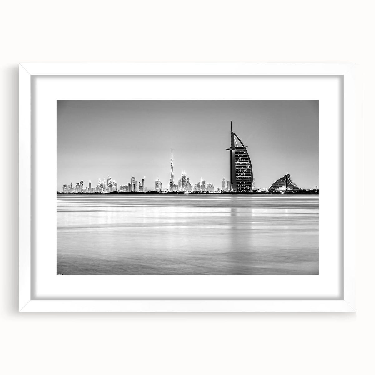 Abstract art print of Burj Al Arab in muted blue and gray, framed with a white mat.