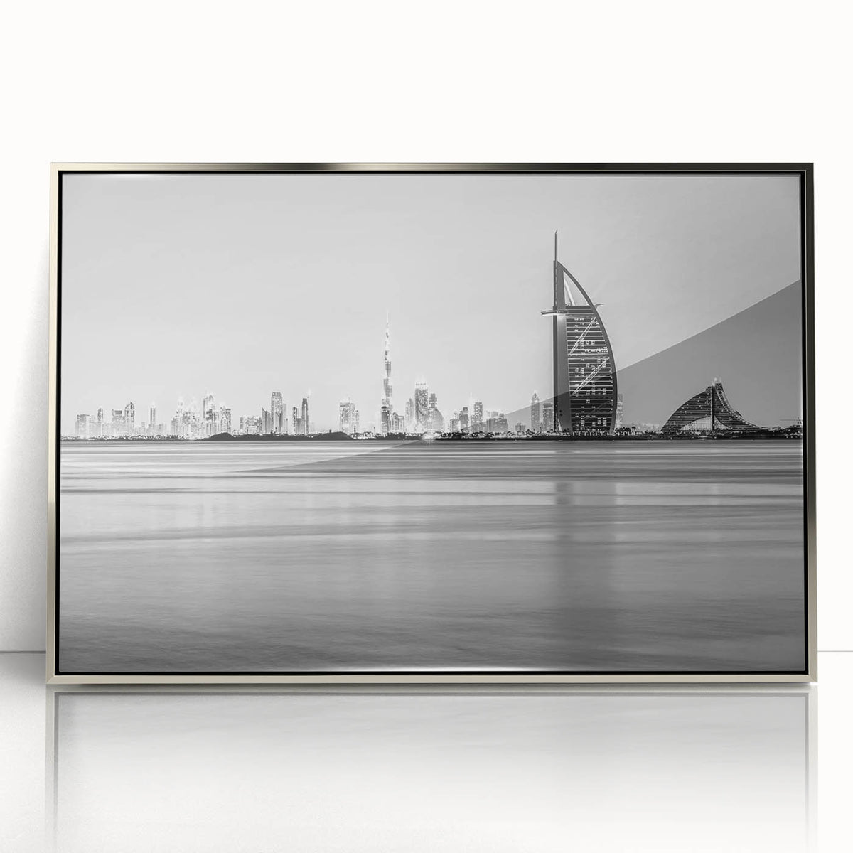 Mid-century modernist art depicting the Burj Al Arab in muted silver tones on a framed acrylic.