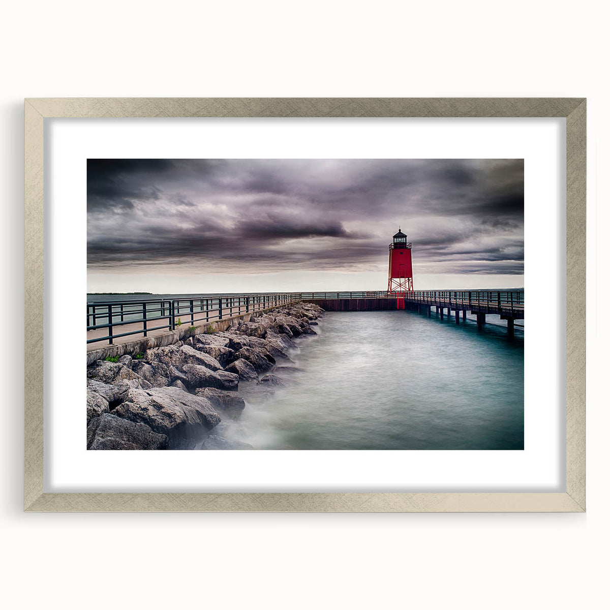 Textured abstract art print of Lake Michigan in muted blue tones on a framed canvas, suitable for enhancing bedroom ambiance.