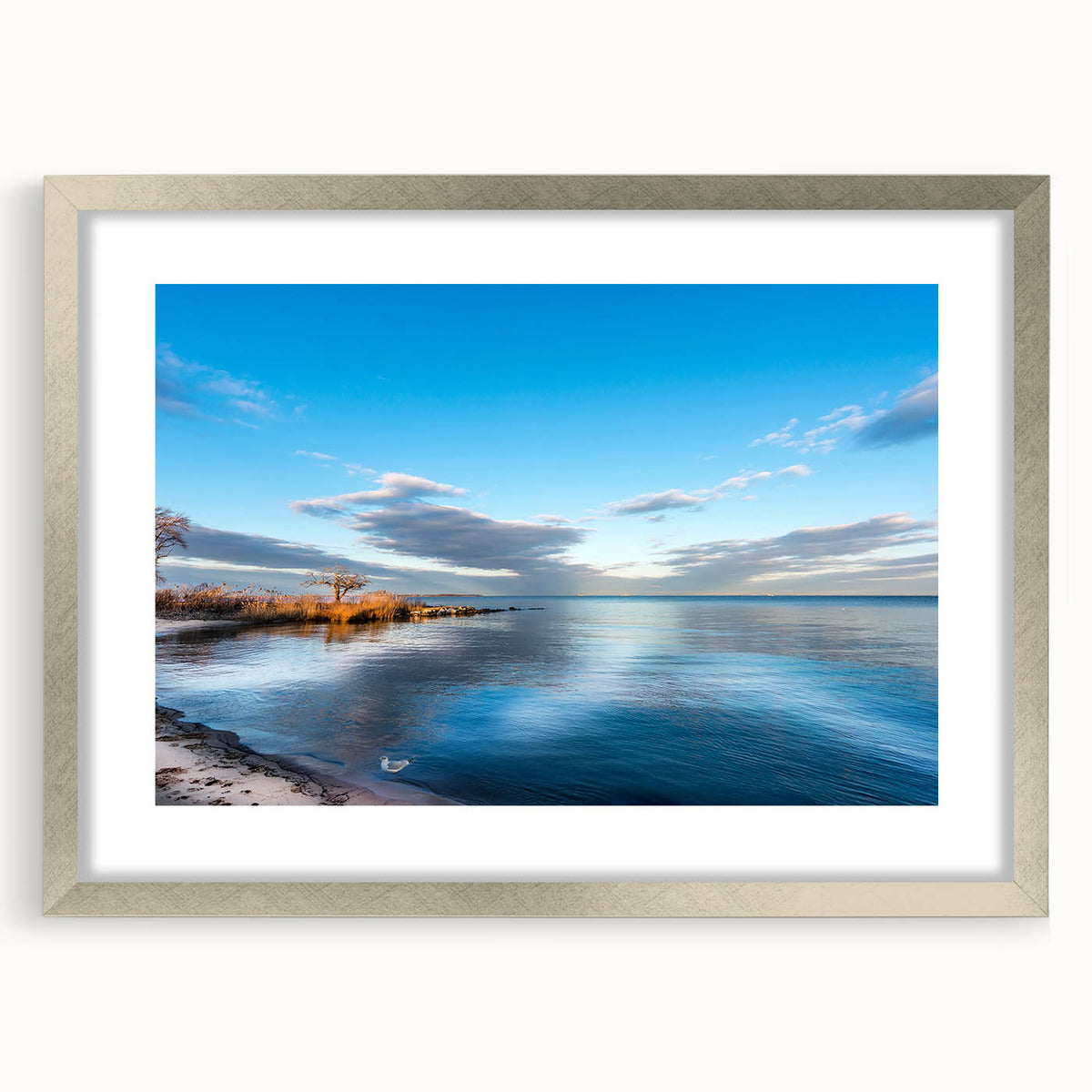 Textured art of Chesapeake Bay in muted blue and green tones on a framed silver mat, suitable for bedroom decor.