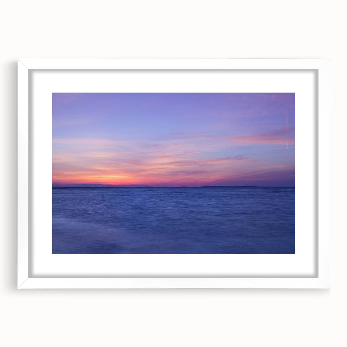 Abstract art print of Cape Cod landscape in muted blue and green tones on a white-framed mat, ideal for dining room decor.