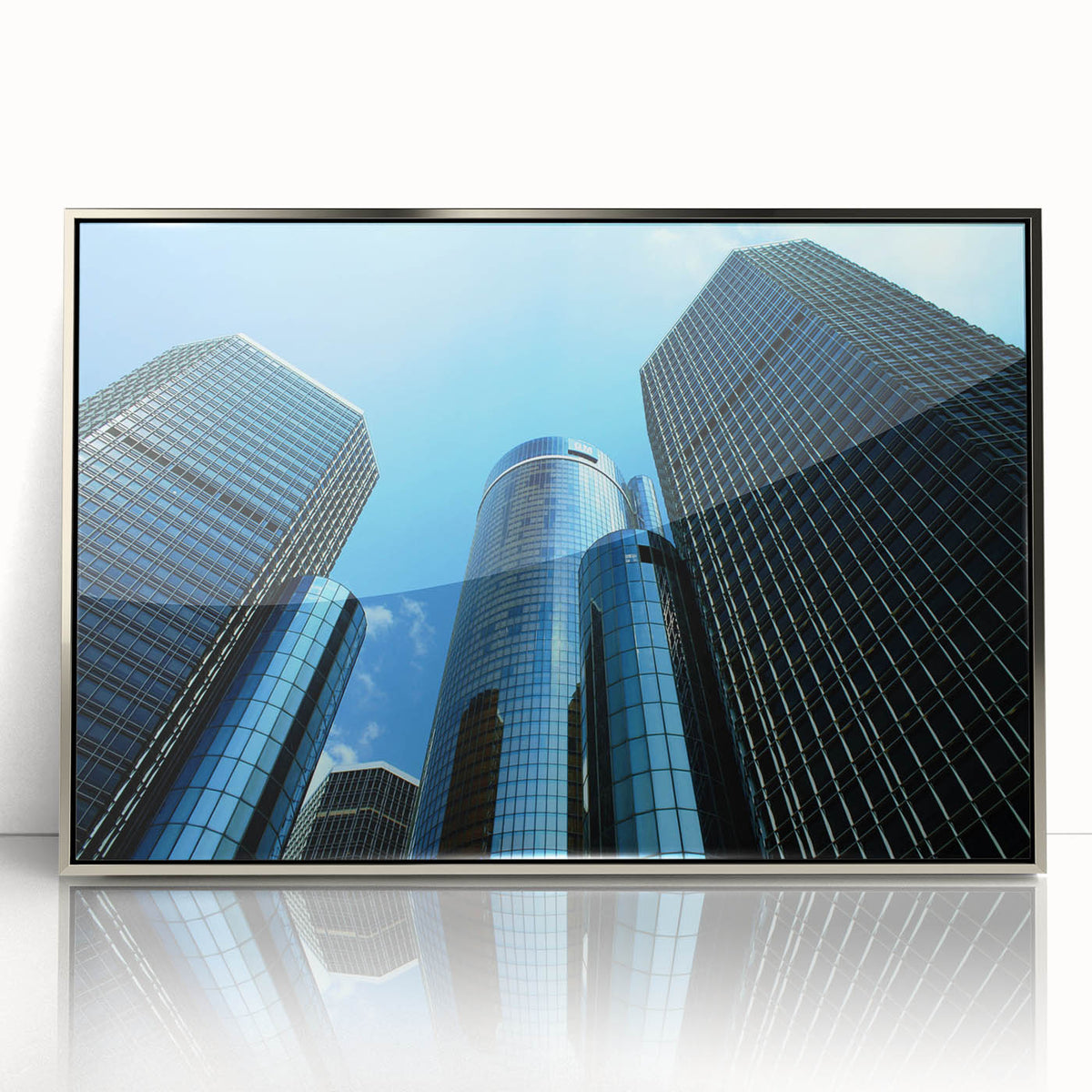 Mid-century modernist art of Detroit skyline in muted gray and blue tones on a framed acrylic print.