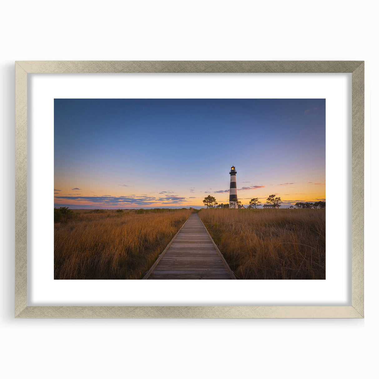 Textured abstract art print of Cape Hatteras in muted blue and gray tones on a framed silver mat, ideal for bedroom art.