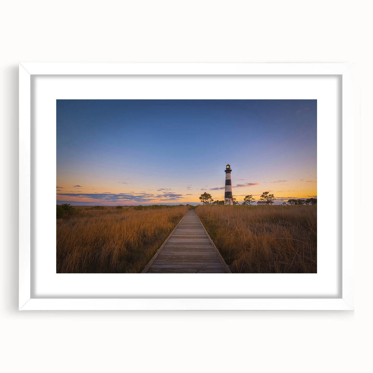 Abstract art print of Cape Hatteras with muted blue and beige tones on a framed white mat, ideal for dining room decor.