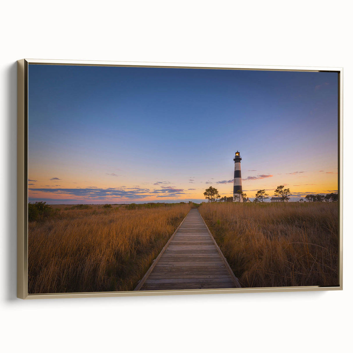 Framed canvas of Cape Hatteras landscape in black and gold tones, ideal for bedroom wall art.