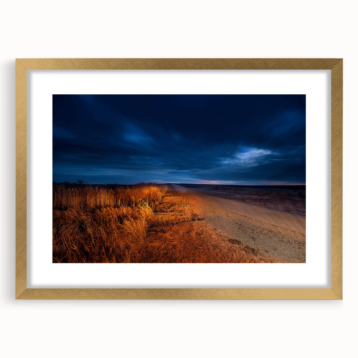 Extra large abstract art print of North Dakota scenery in gold frame, featuring textured earth tones.