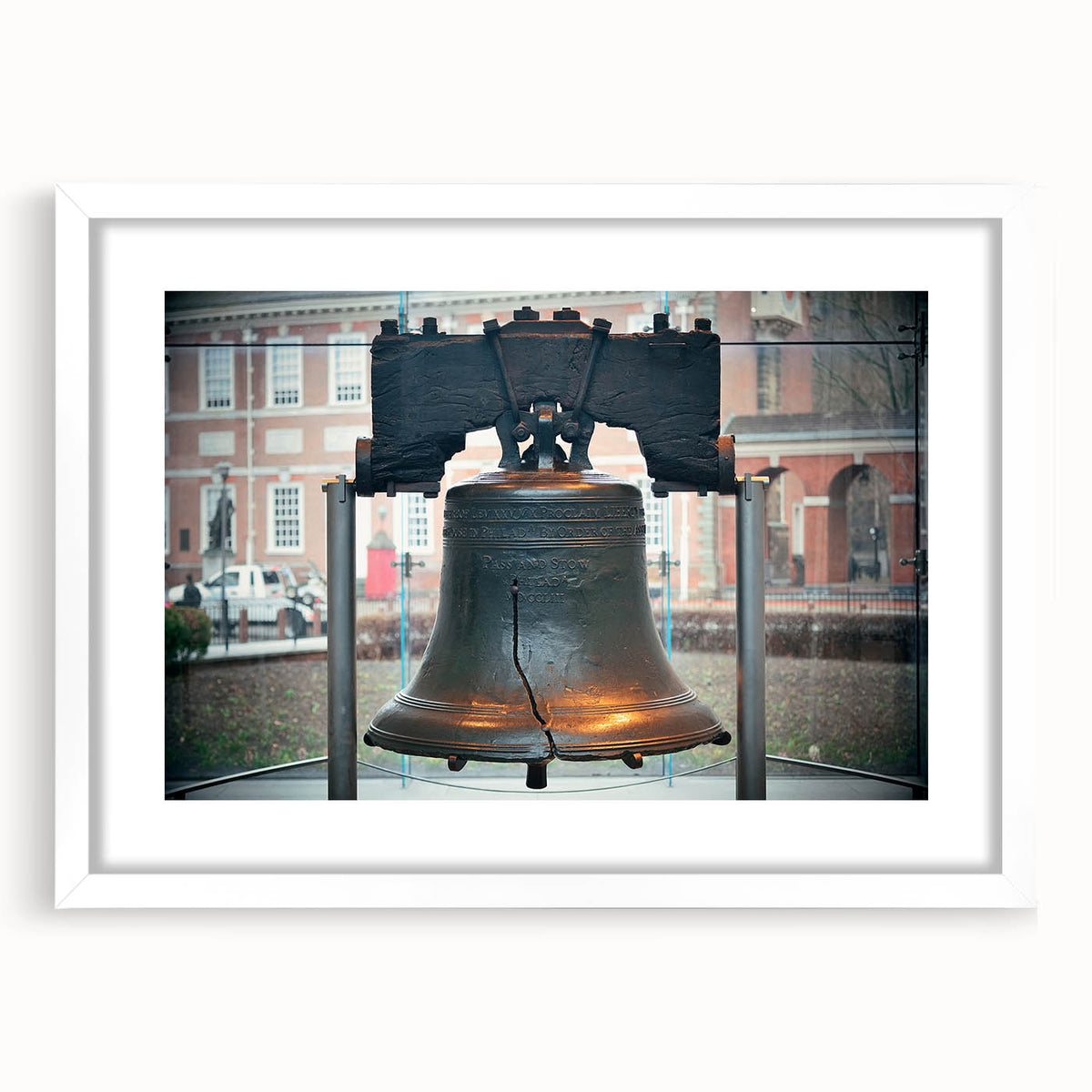 Abstract art print of Philadelphia skyline in muted blue and gray tones on a framed canvas, suitable for dining room decor.