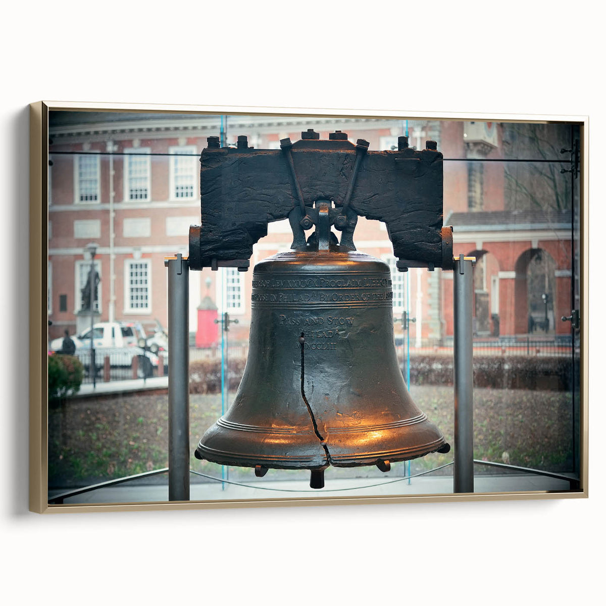 Framed canvas featuring a vintage-style landscape painting of Philadelphia in muted gold and black tones.