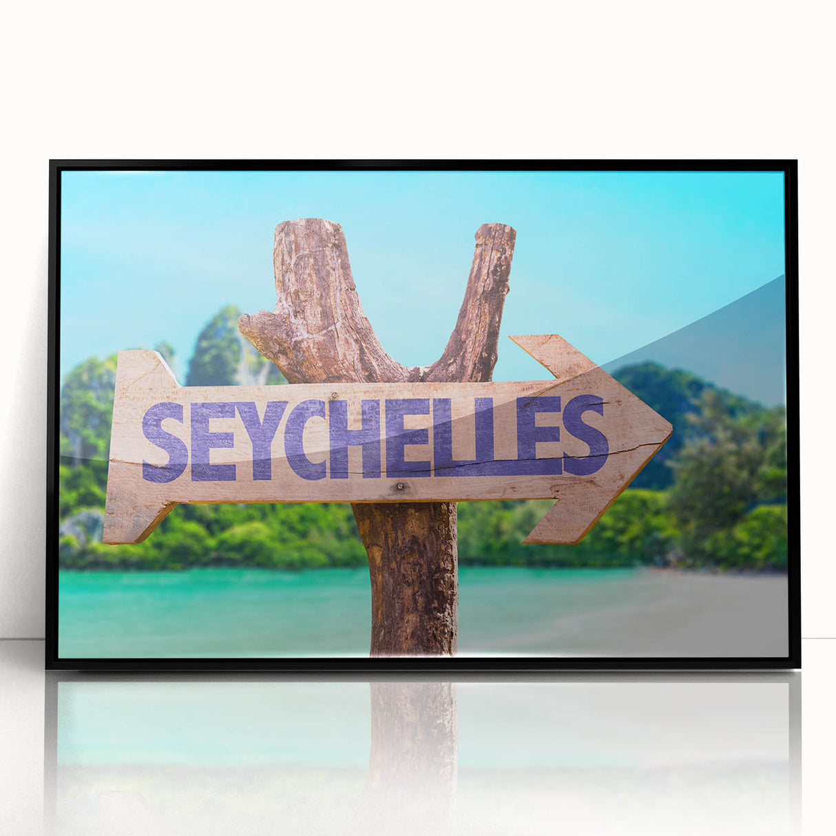 Large abstract wall art depicting the Seychelles scenery in muted blue and green tones on a framed acrylic.