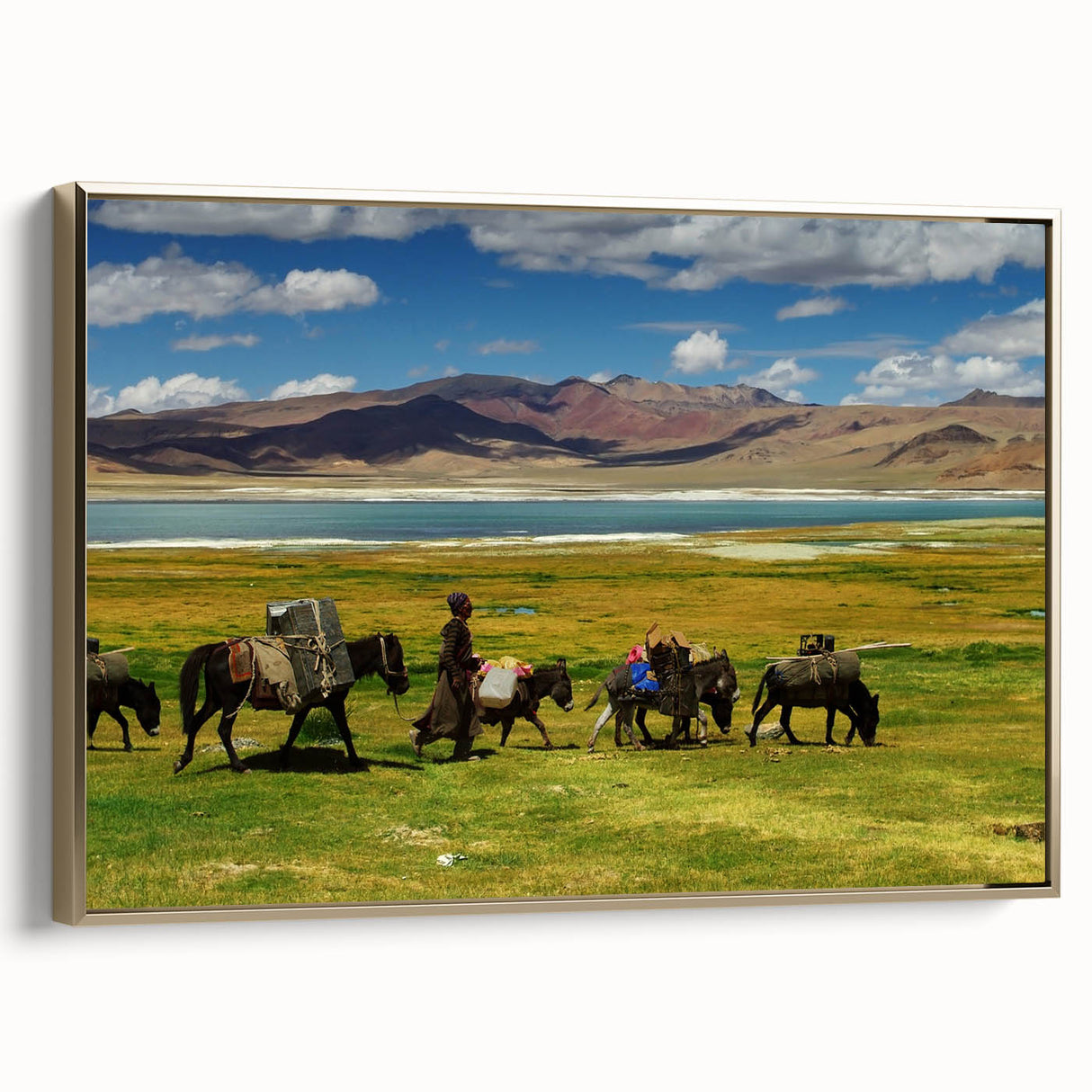 Framed canvas featuring a vintage-style landscape painting of Tibet with a predominantly black and gold color palette.