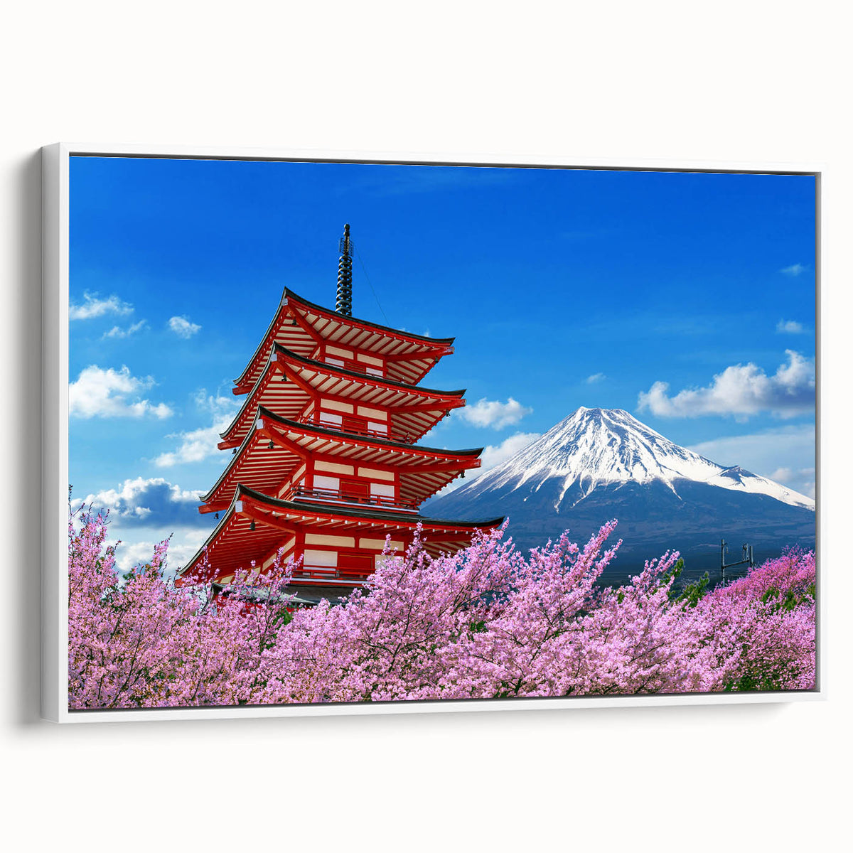 Vintage poster art of Mount Fuji with colorful background on a framed white canvas, ideal for living room decor.