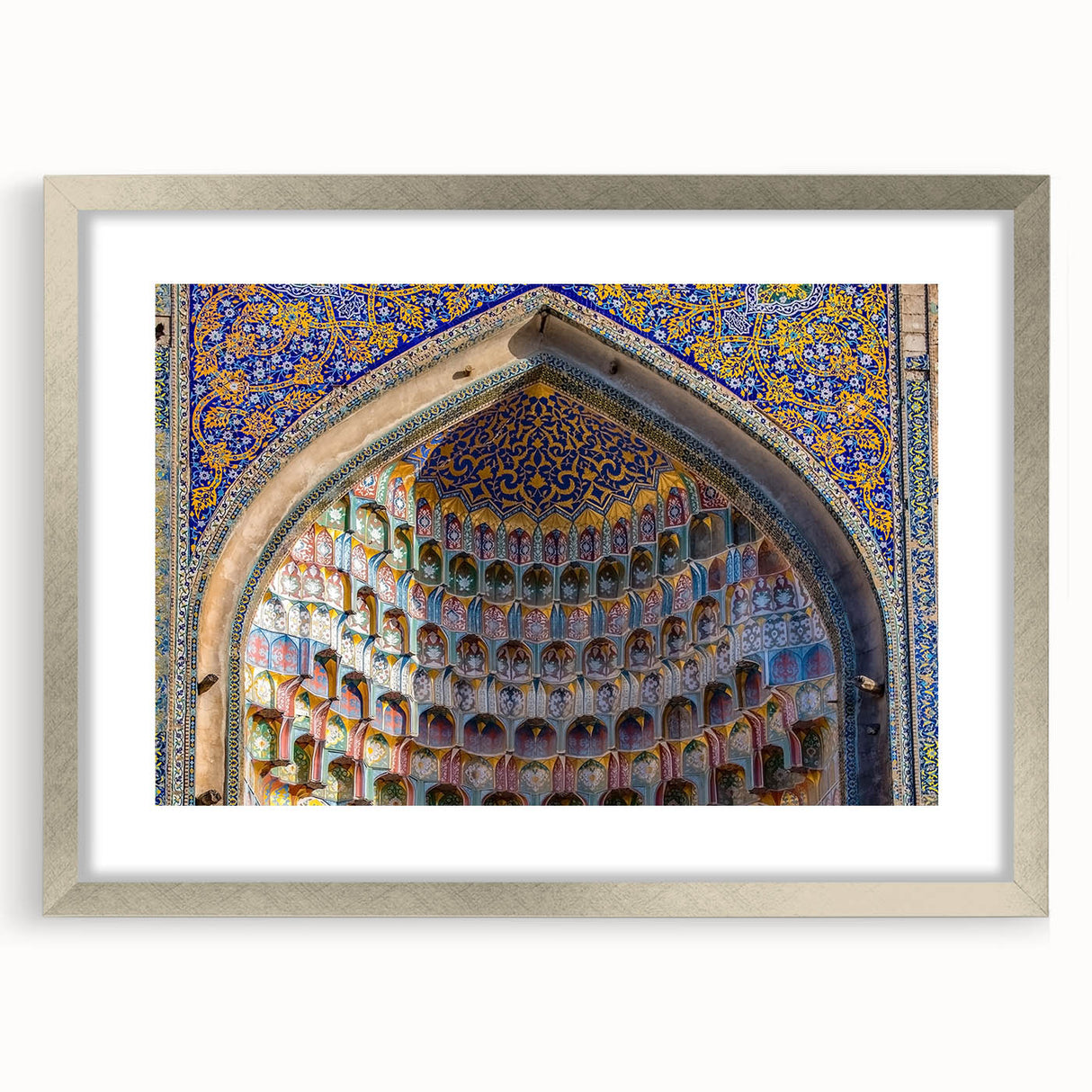 Textured art print of an abstract scenery in muted earth tones, framed in silver, ideal for bedroom decor.