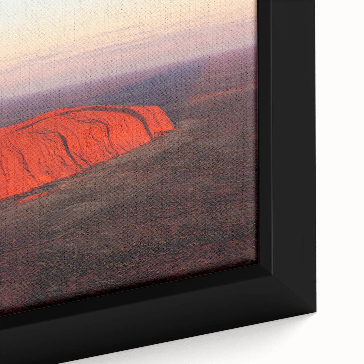 Framed canvas featuring a textured depiction of Ayers Rock in Australia, using a black and colorful art palette.