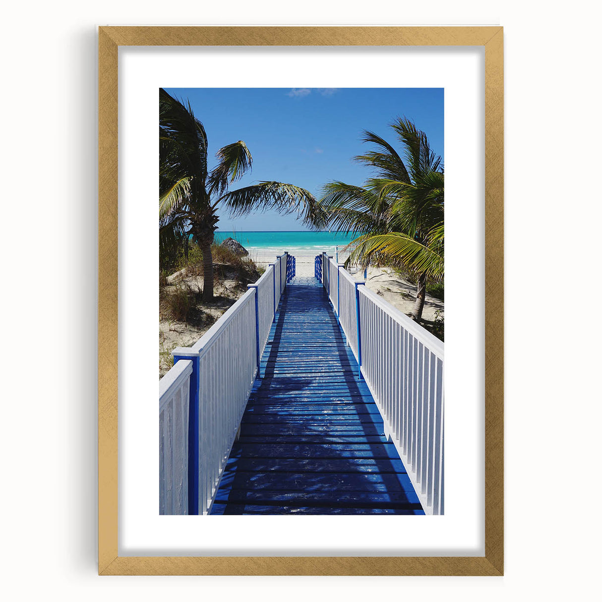 Abstract art print of a Caribbean landscape in muted blue and green, framed in gold.