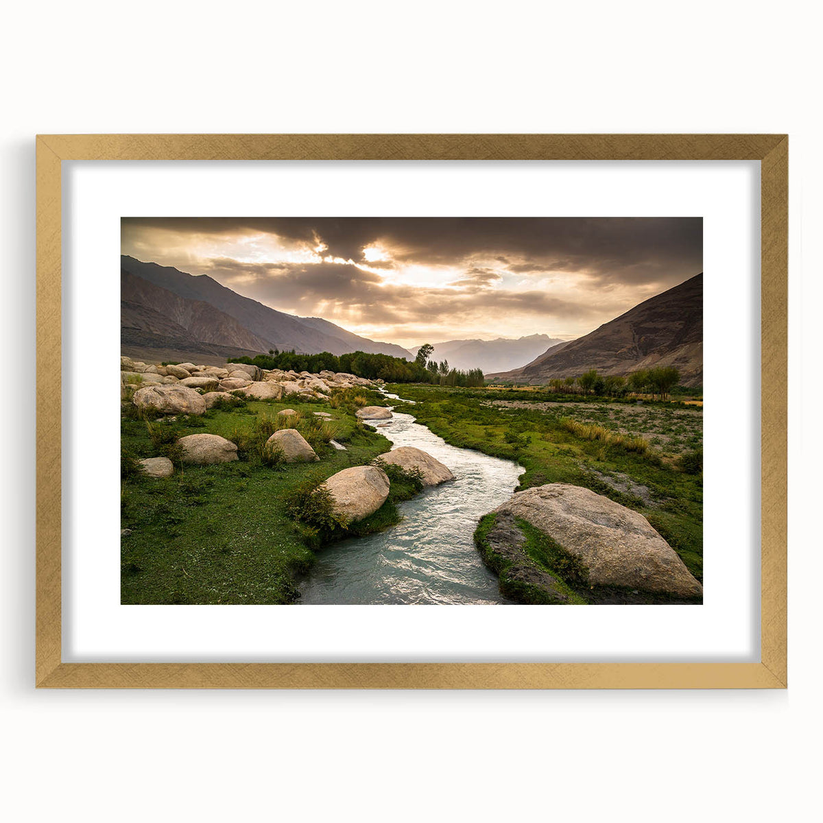 Extra large abstract art print of a Middle Eastern scenery in muted gold and brown tones, framed with a gold mat.